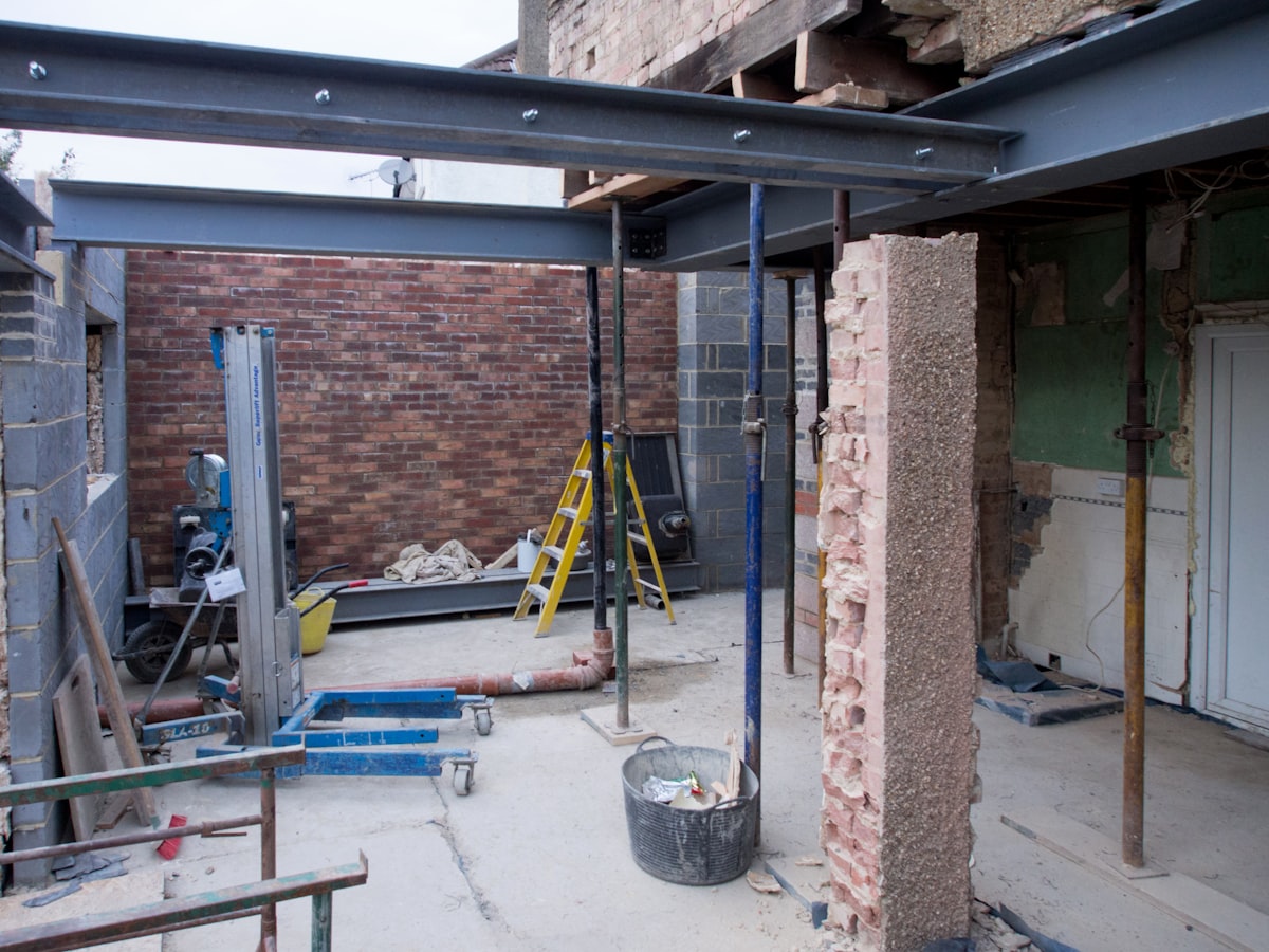 Steel beam installed over a new structural opening in a house extension