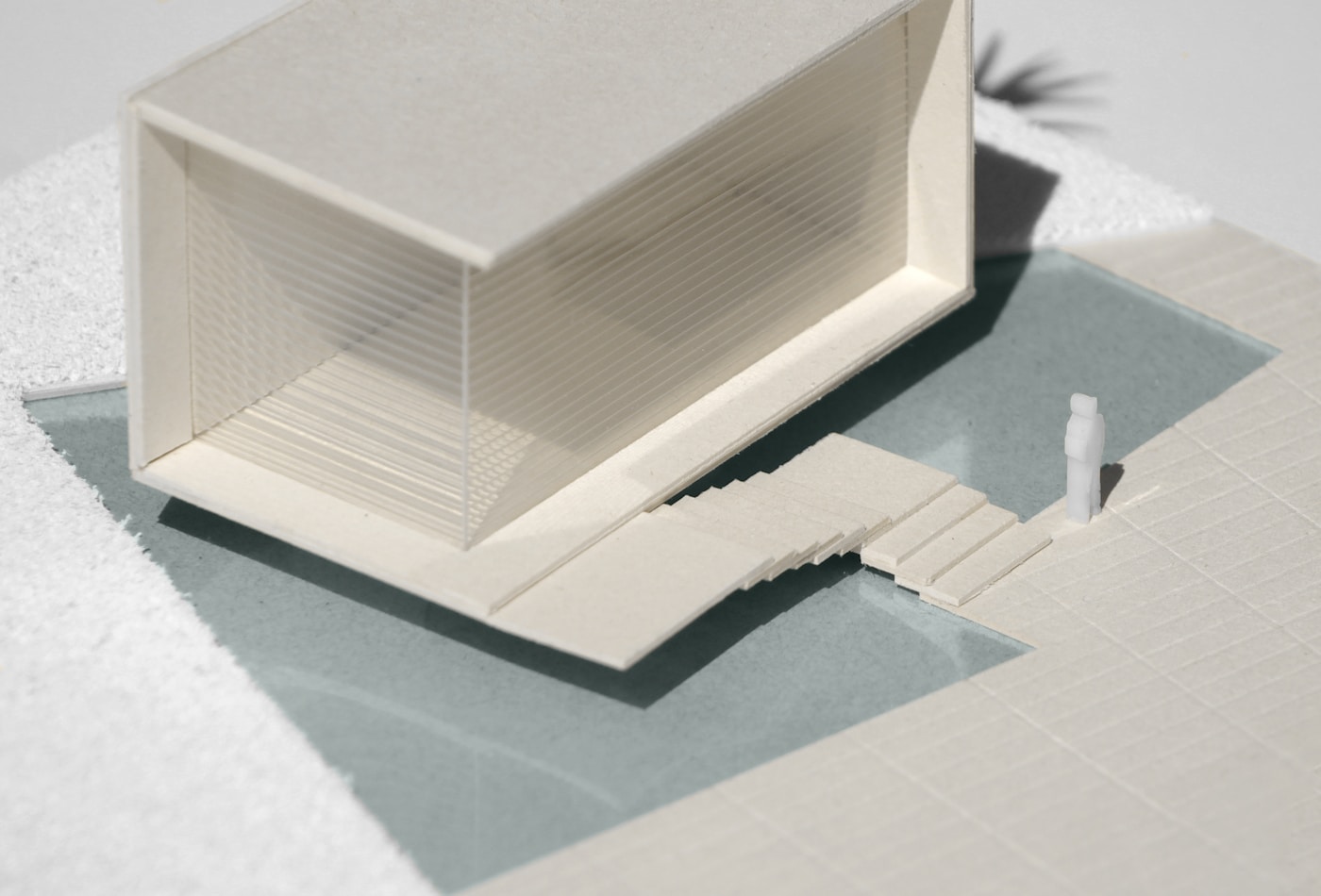 A physical study model testing a building against its landscape and steps
